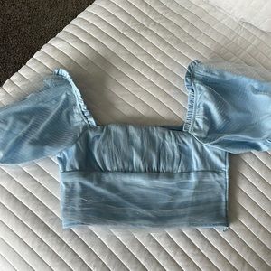 New with tags baby blue fashion nova top!